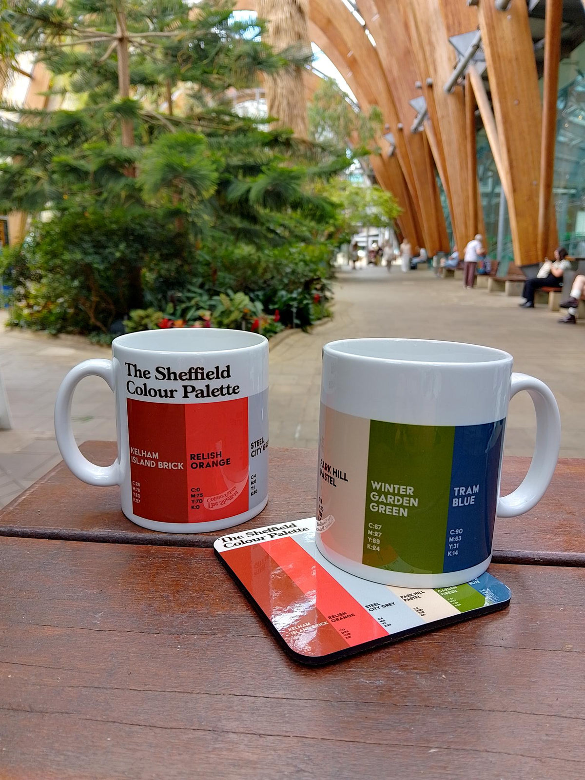 Colour Palette mugs and coaster photographed at a visitor attraction