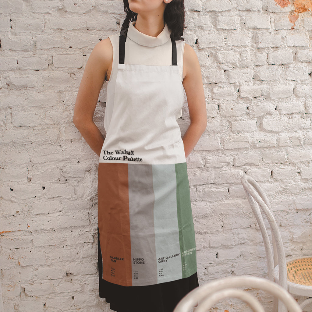 Walsall Colour Palette apron decorated with six colours inspired by the town’s saddlery heritage, famous landmarks and notable local people.
