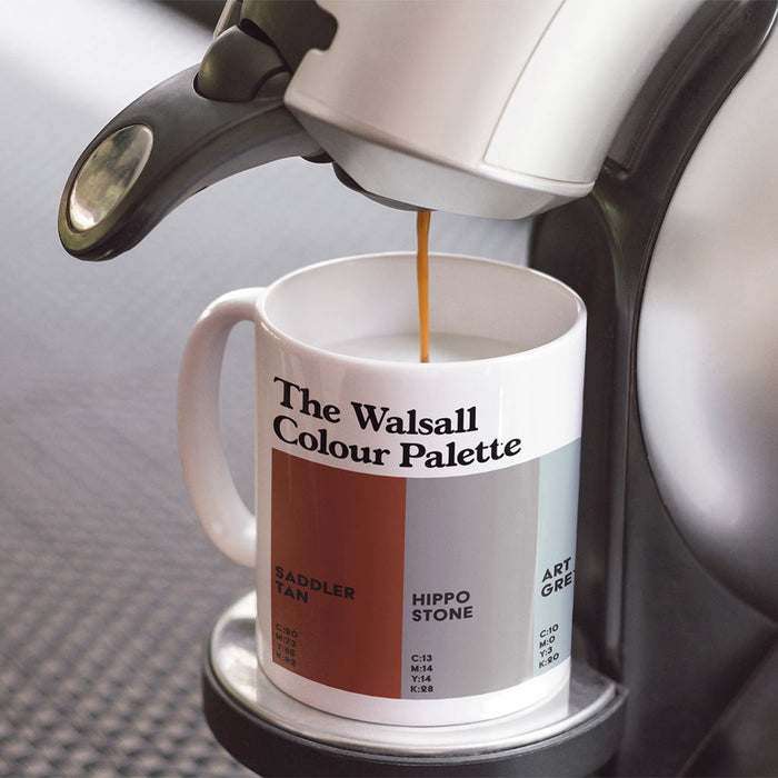 White porcelain Walsall Colour Palette mug featuring colour swatches inspired by Walsall’s saddlery heritage, hippo sculpture and local landmarks.