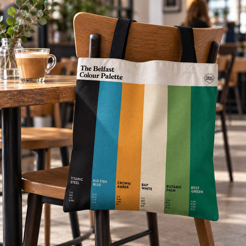 Belfast Colour Palette cotton tote shopper bag with black handles and six vertical colour swatches inspired by the city’s landmarks and culture.