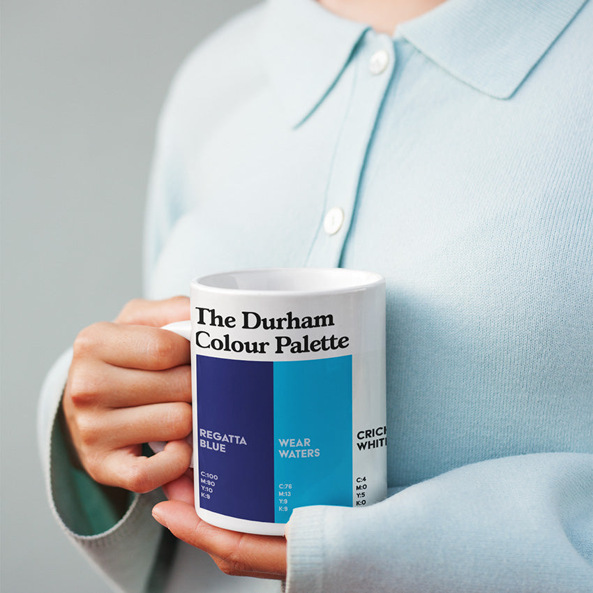 Durham Colour Palette porcelain mug with six colour swatches celebrating Durham Cathedral, the River Wear, Chester-le-Street cricket and County Durham mining.