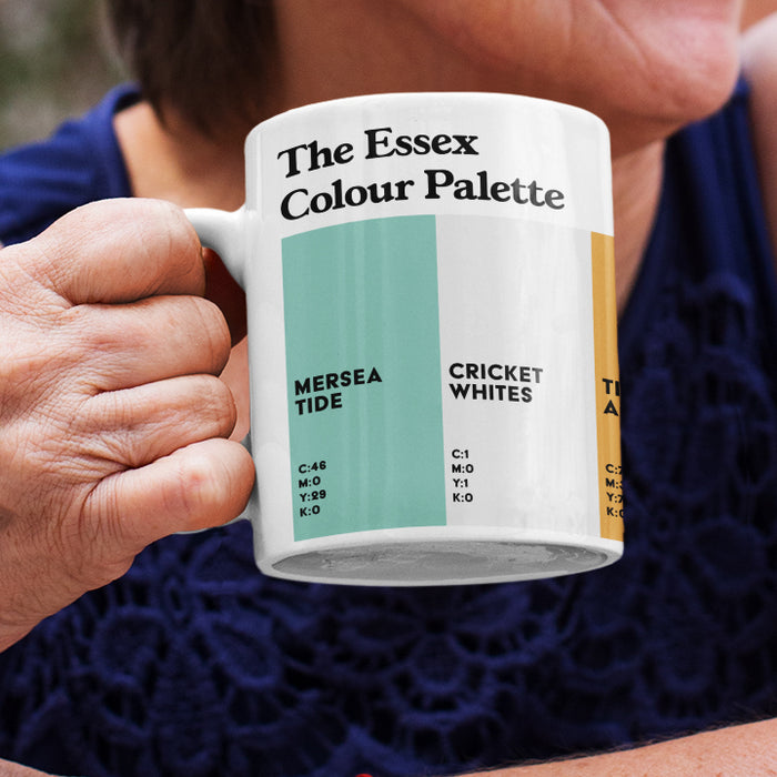 White porcelain Essex Colour Palette mug featuring colour swatches inspired by Mersea Island, Chelmsford cricket and Tiptree’s famous preserves.