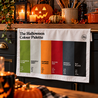 The Halloween Colour Palette tea towel in a spooky kitchen
