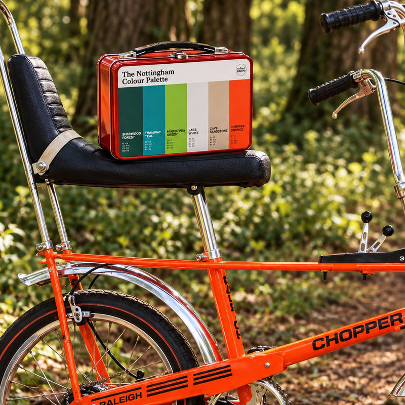 Nottingham metal retro lunch box on a Raleigh Chopper Bike